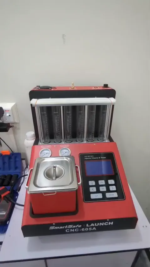 Close-up of the ultrasonic cleaning bath and control panel of the injector cleaning machine